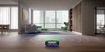robot aspirador Dyson Spot+Scrub Ai a limpar chão com luz verde e rolo húmido em funcionamento