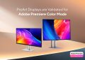 Monitor ASUS ProArt Display OLED PA27UCDMR sobre secretária de edição profissional com interface do Adobe Premiere aberta em modo HDR com paleta de cores calibrada visível
