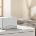 Sistema Mesh MERCUSYS Halo H25BE com duas unidades distribuídas por uma casa moderna para cobertura Wi-Fi 7.